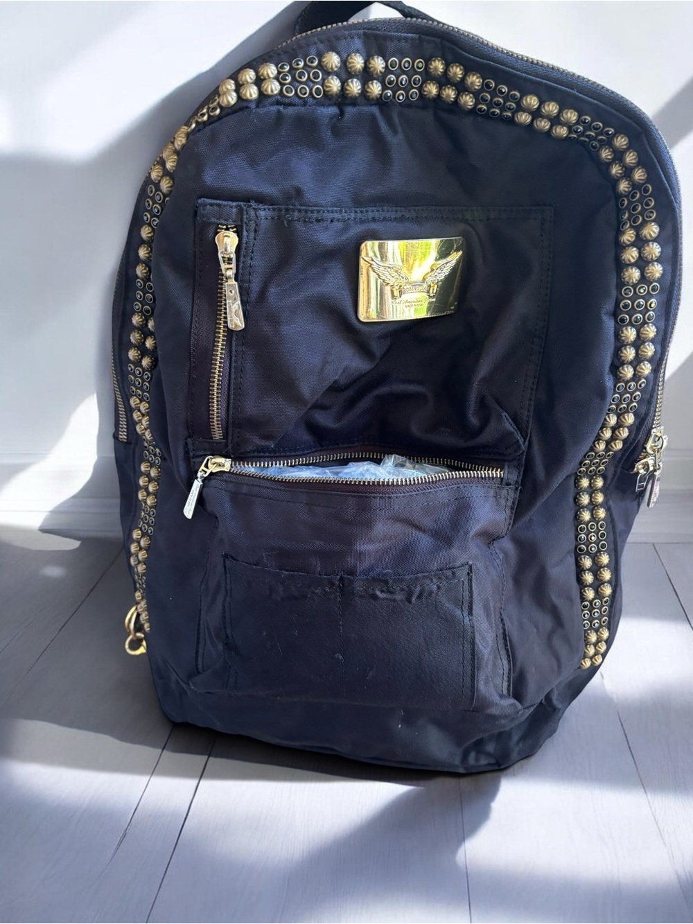 Jean Studded Backpack designed with an edgy  streetwear aesthetic.